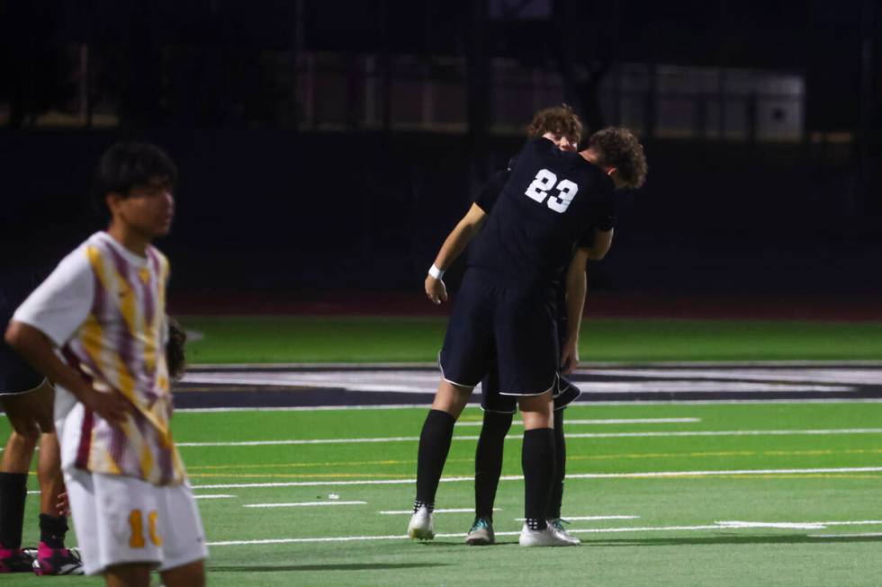 Palo Verde defender Ben Legrand (23) hugs a teammate after defeating Eldorado in a Class 5A Sou ...