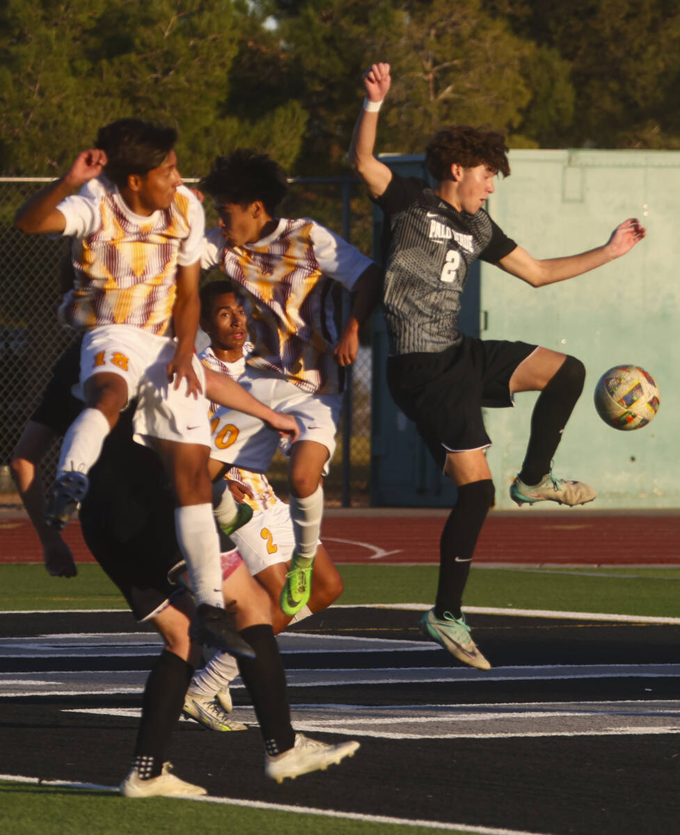 Palo Verde defender Jaxon Law (2) kicks the ball in front of a group of Eldorado players during ...