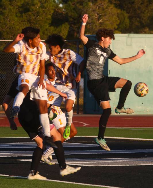 Palo Verde defender Jaxon Law (2) kicks the ball in front of a group of Eldorado players during ...