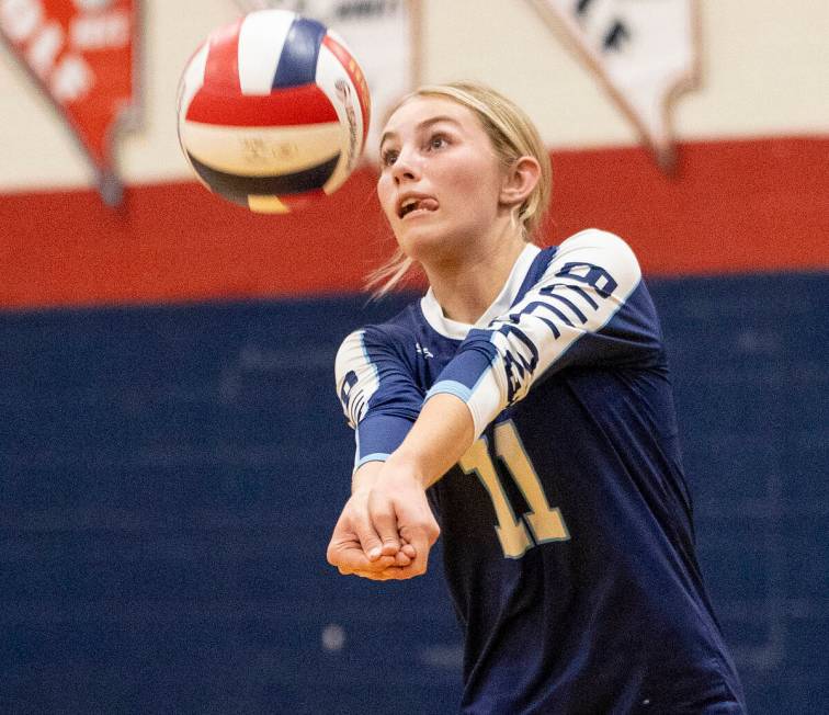 Centennial sophomore Olivia Roberts (11) receives the ball during the 5A girls volleyball South ...