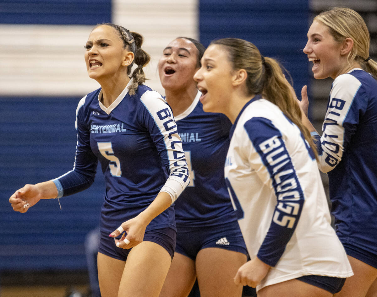 Centennial players celebrate a play during the 5A girls volleyball Southern Region semifinal ag ...