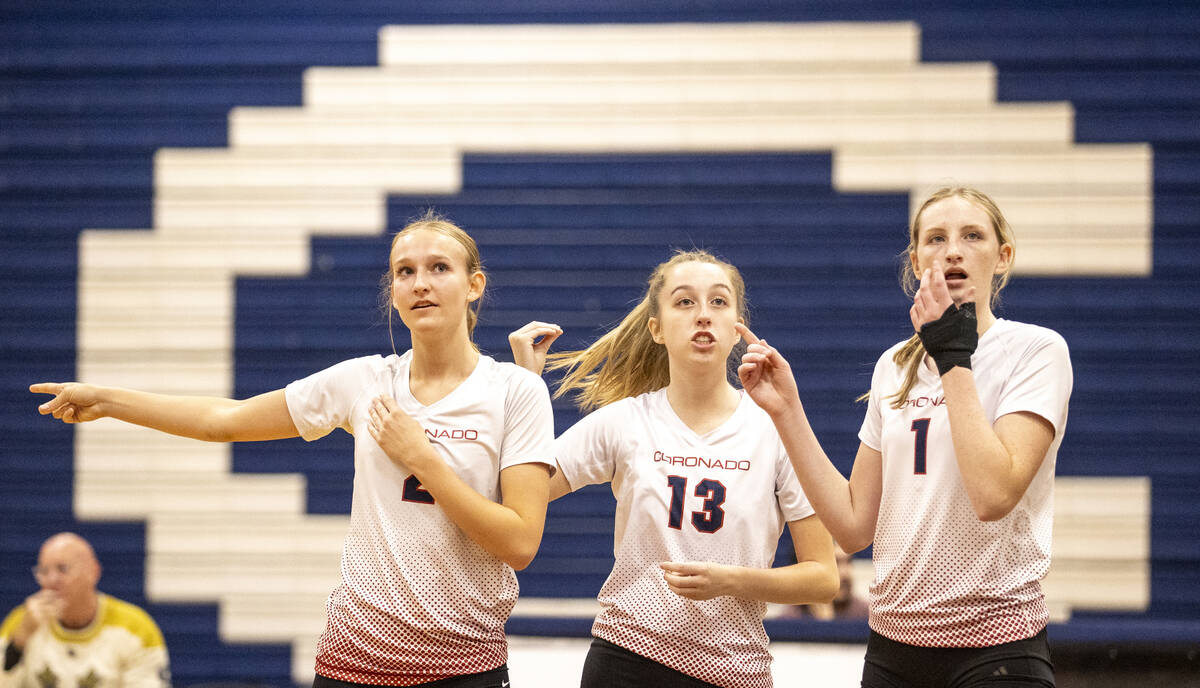 Coronado players become confused as two referees make different calls during the 5A girls volle ...