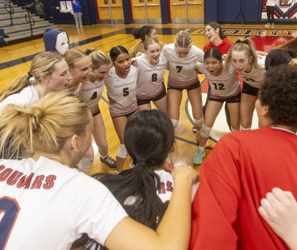 Coronado players huddle together before the 5A girls volleyball Southern Region semifinal again ...