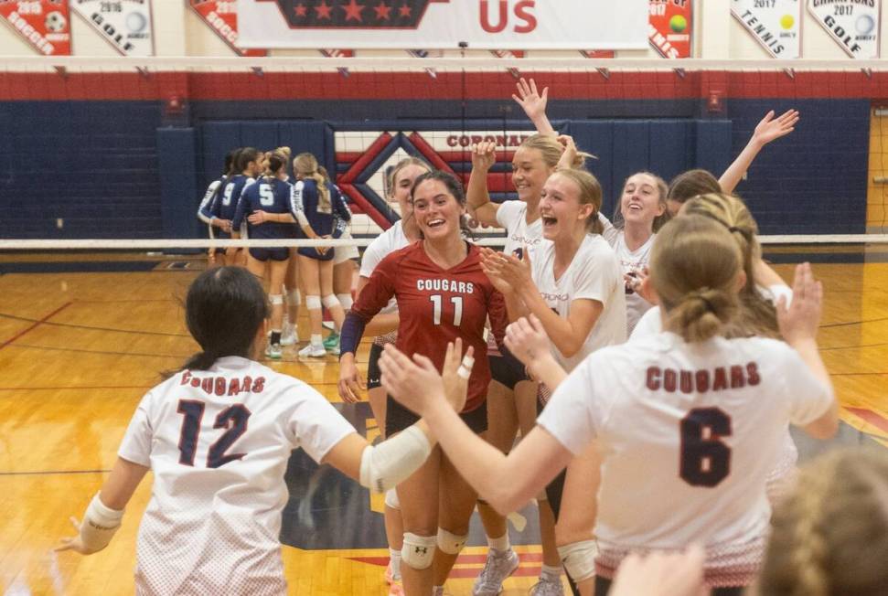 Coronado players celebrate after winning the 5A girls volleyball Southern Region semifinal 3-0 ...