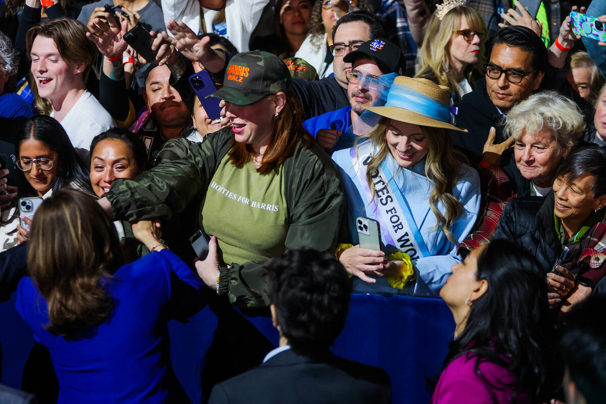 Supporters of Democratic presidential nominee Vice President Kamala Harris greet her during a c ...