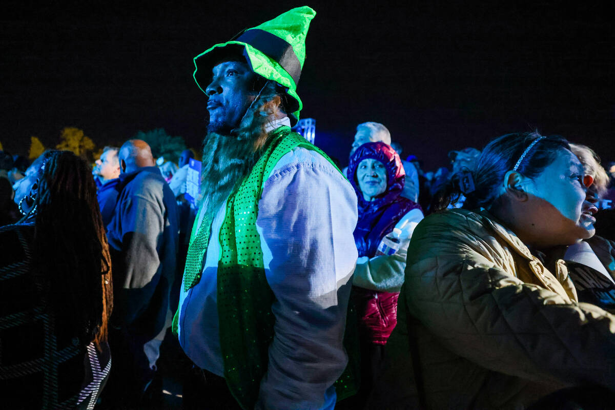 Supporters wait for Democratic presidential nominee Vice President Kamala Harris to speak durin ...