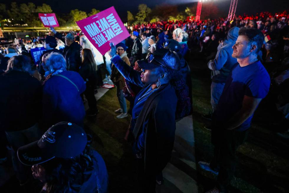 Supporters wait for Democratic presidential nominee Vice President Kamala Harris to speak durin ...