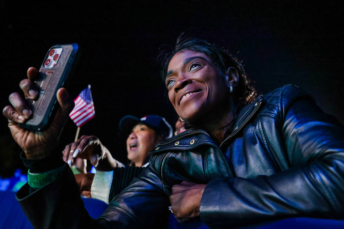 A supporter records Democratic presidential nominee Vice President Kamala Harris during a campa ...