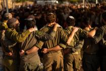 Israeli soldiers mourn during the funeral of reservist Yedidia Bloch, 31, at Mevo Horon settlem ...