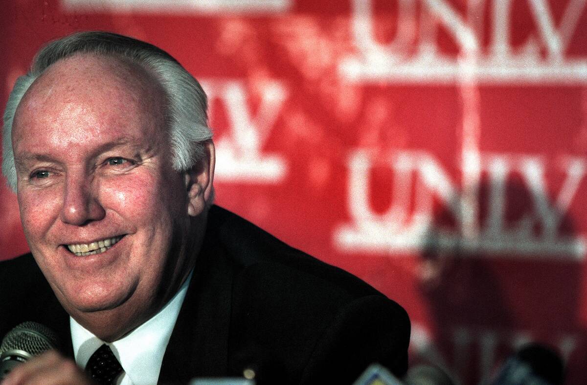 John Robinson, 63, smiles while introduced as the new UNLV football coach at a press conference ...