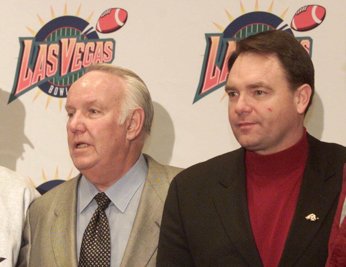 UNLV Football coach John Robinson(left) and Arkansas Football coach at press conference. Photo ...