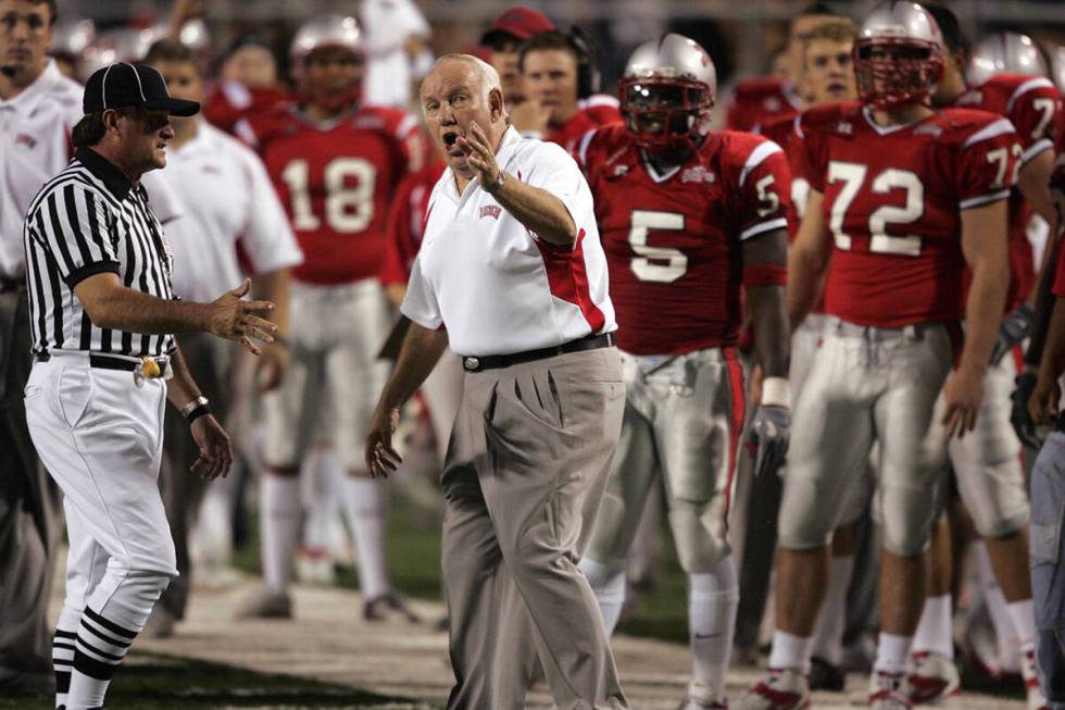 UNLV Head Coach John Robinson argues a call after watching the replay while playing against Nev ...