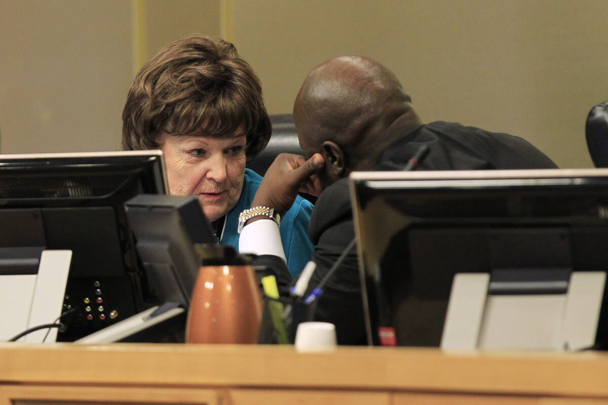 Councilwoman Lois Tarkanian confers with councilman Ricki Barlow as a vote approaches on a prop ...