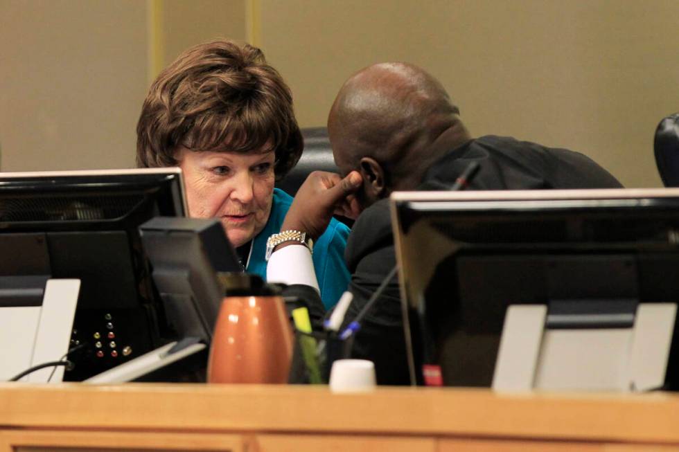 Councilwoman Lois Tarkanian confers with councilman Ricki Barlow as a vote approaches on a prop ...