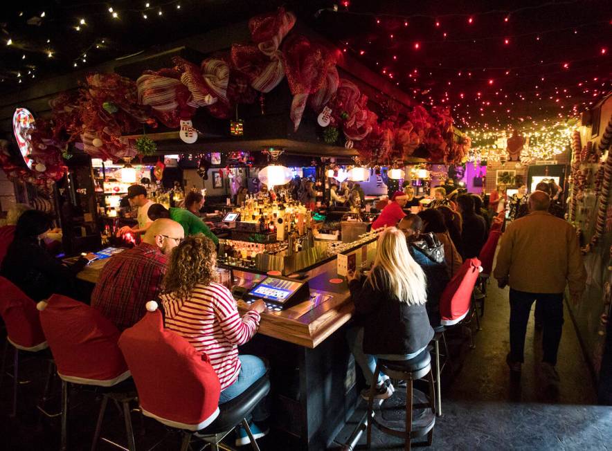 Guests at the bar of the Sand Dollar Lounge in Las Vegas, Monday, Nov. 25, 2019. The bar is hos ...