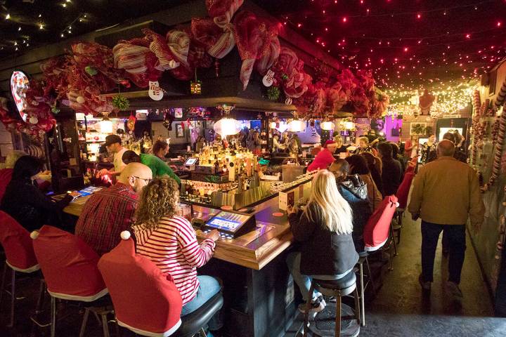 Guests at the bar of the Sand Dollar Lounge in Las Vegas, Monday, Nov. 25, 2019. The bar is hos ...