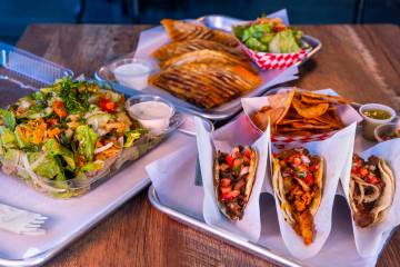 (Clockwise from left) Fattoush salad, beef and lamb shawarmadilla and beef and chicken tacos se ...