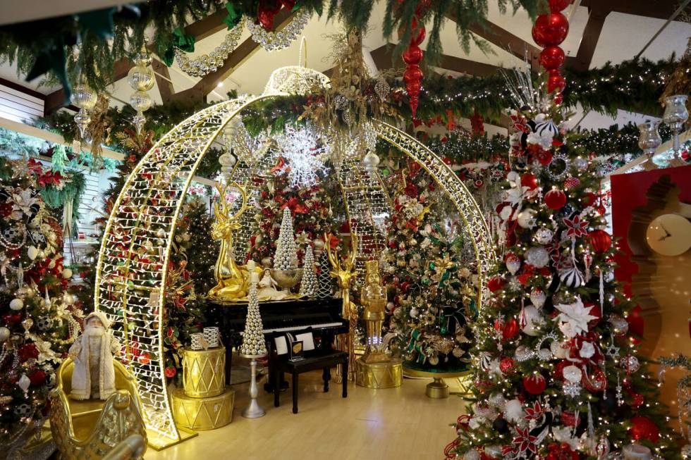 Christmas decorations, including a room-size ornament, are set up for sale at Ralph Jones Displ ...