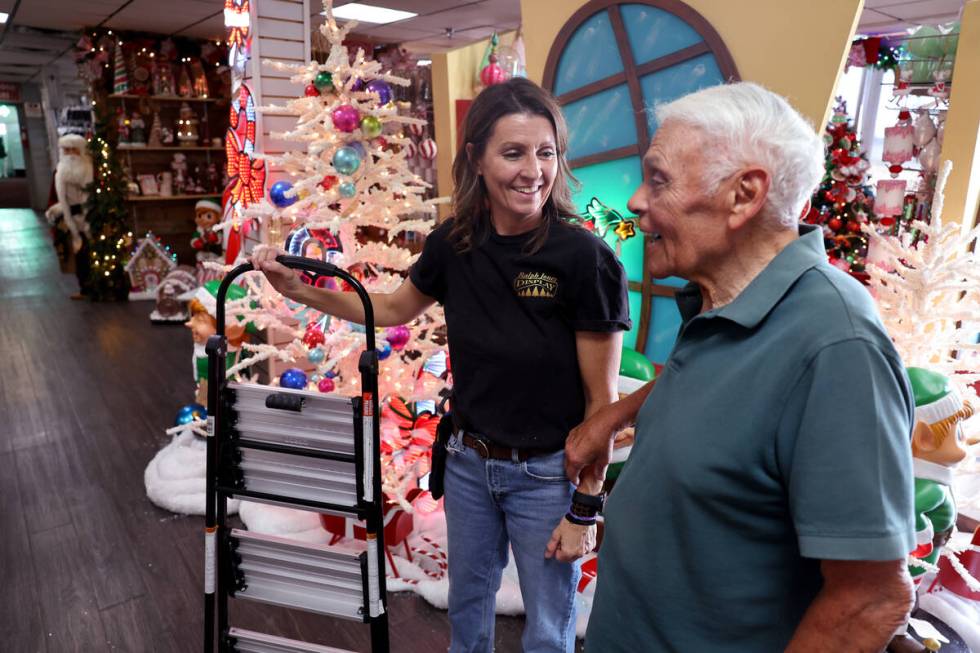 Co-owner Kate Jones, left, visits with 25-year customer Joe Montalvo at Ralph Jones Display at ...