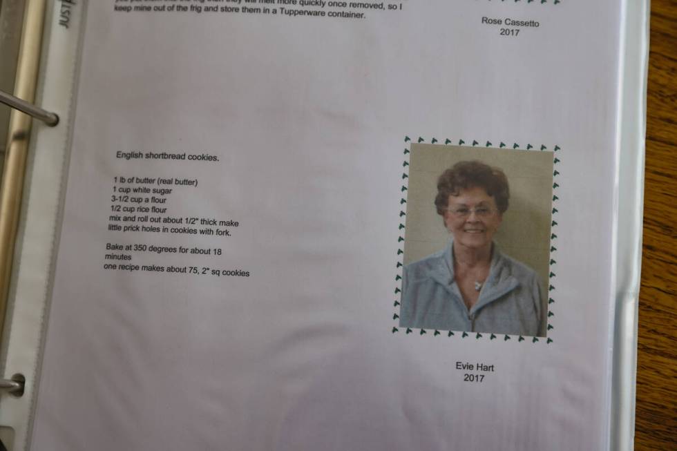 A photo of Evie Schild Hart next to her recipe in a cookbook documenting the recipes of a Chris ...