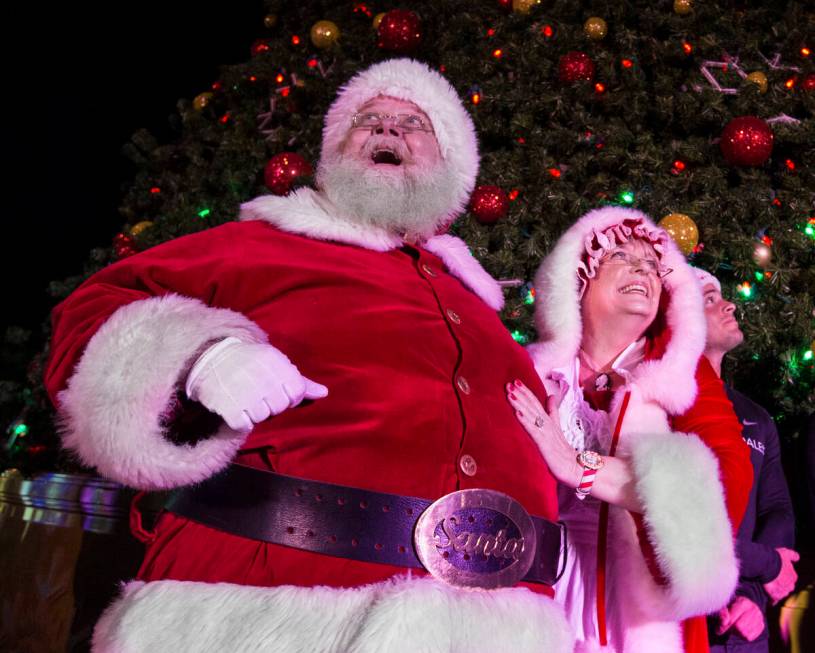 Santa and Mrs. Claus enjoy the fireworks at Opportunity Village's Magical Forest on Friday, Nov ...