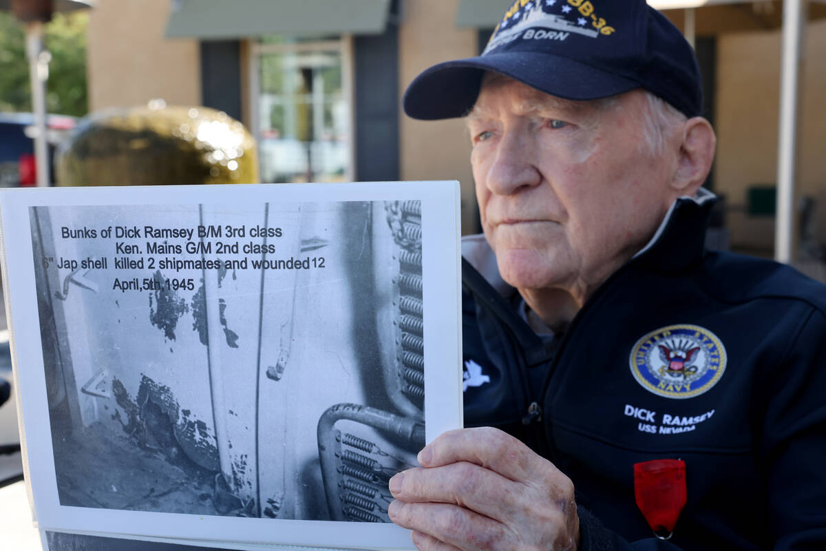 Dick Ramsey, 101, shows a photo of his bunk on the USS Nevada that was hit during the attack on ...