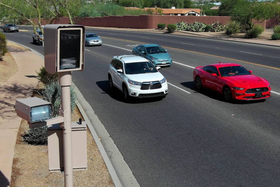 A red light camera is seen at Tatum Boulevard and McDonald Drive in Paradise Valley, Arizona Mo ...