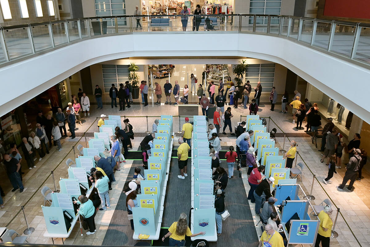 Voters take part in early voting on Oct. 19, 2024, a the Galleria Mall in Henderson. (Sam Morri ...