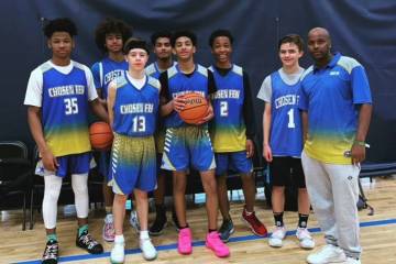 Select Few, a youth basketball team based in Vegas, poses for a photo with Coach Abdul Adem (fa ...