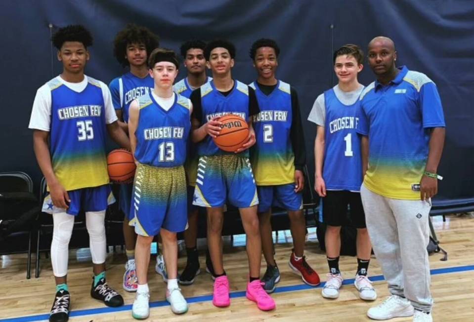 Chosen Few, a youth basketball team based in Vegas, poses for a photo with Coach Abdul Adem (fa ...