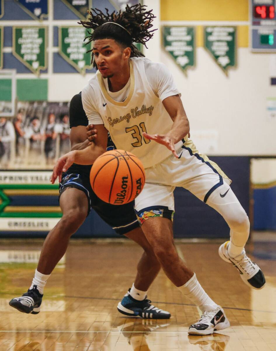 Spring Valley point guard Alijah Adem (31) struggles to keep the ball during a game against Des ...