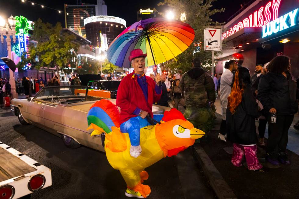 Erick Walck of Las Vegas walks along Fremont Street during Halloween night on Thursday, Oct. 31 ...