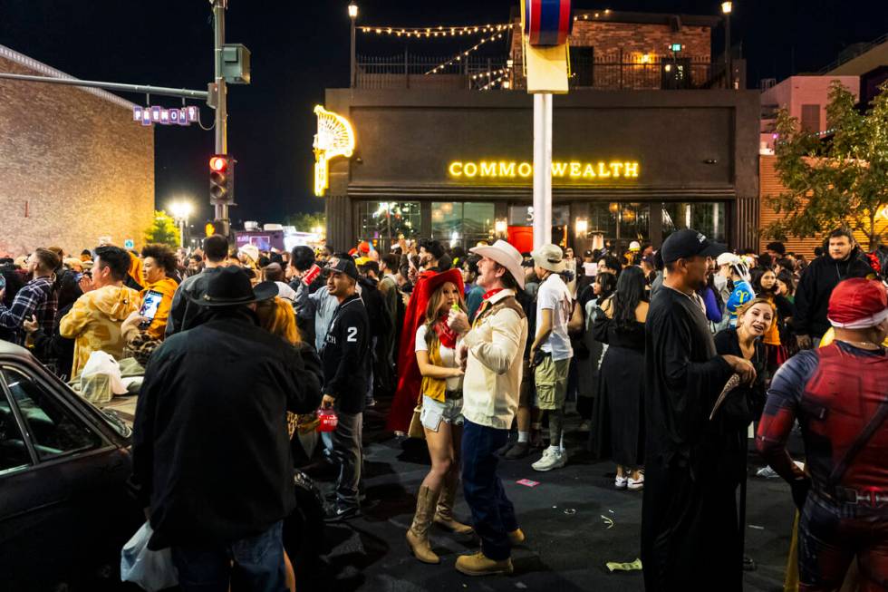 People dance along Fremont Street during Halloween night on Friday, Nov. 1, 2024, in Las Vegas. ...