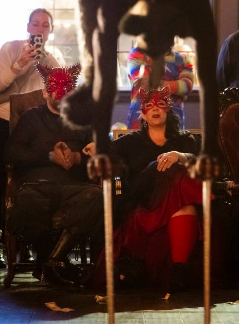 Attendees watch as contortionist Mariama performs during the Cauldron Noir burlesque and variet ...