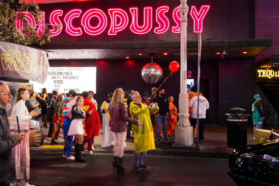 People take in the sights around Fremont Street during Halloween night on Thursday, Oct. 31, 20 ...