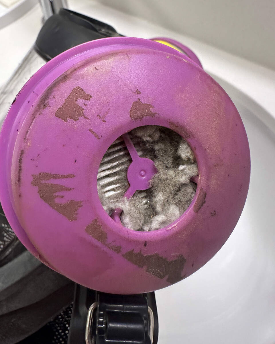 In a photo provided by Steven Pieri, a respirator clogged with debris is seen while he and volu ...