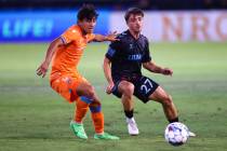 Miami FC forward Isaac Zuleta defends while Las Vegas Lights FC midfielder Valentin Noël ( ...