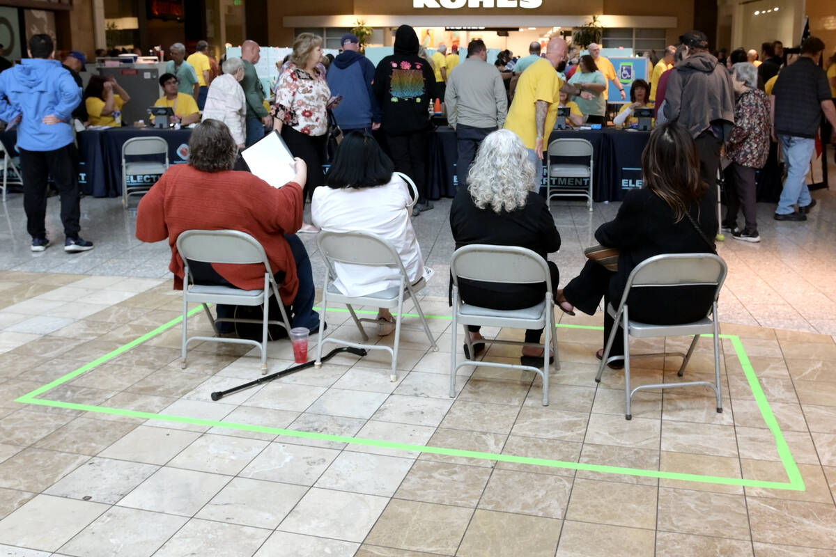 Election observers monitor voting at the Galleria at Sunset mall Saturday, October 19, 2024, in ...