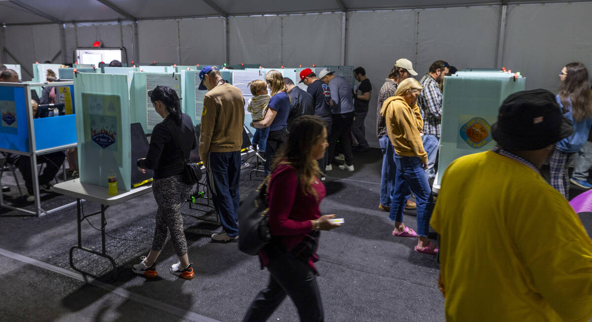 Voters cast their ballots on the final day of early voting at the Thunderbird Family Sports Com ...