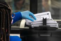 A Clark County election worker scans ballots at the Election Department warehouse, on Tuesday, ...