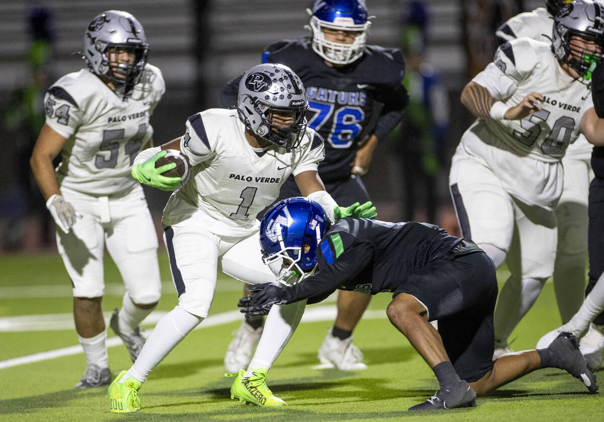 Palo Verde running back Bryant Johnson (1) avoids a tackle during the 5A Division II Southern L ...