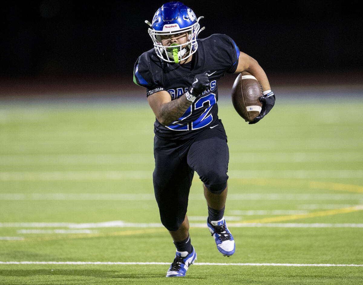 Green Valley running back Cris Dalina (22) runs with the ball during the 5A Division II Souther ...