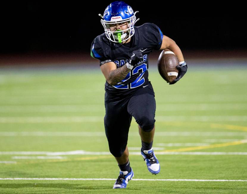 Green Valley running back Cris Dalina (22) runs with the ball during the 5A Division II Souther ...