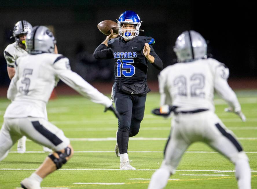 Green Valley quarterback Michael Lewis (15) looks to pass the ball during the 5A Division II So ...