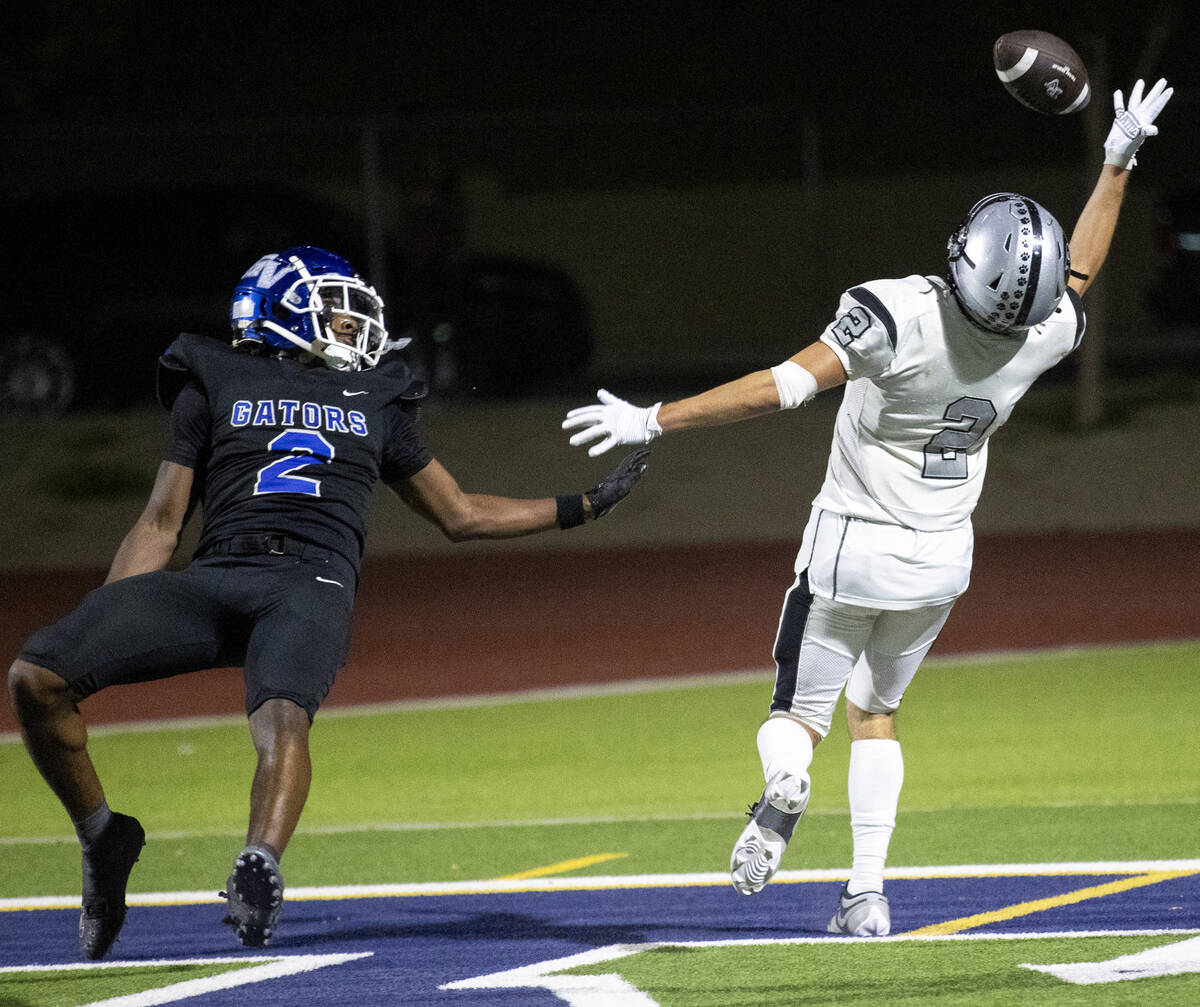 Green Valley junior Evan Williams (2) falls back as Palo Verde senior Slade Knoch (2) attempts ...