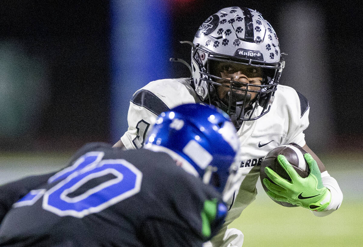 Palo Verde running back Bryant Johnson (1) looks to avoid a defender during the 5A Division II ...