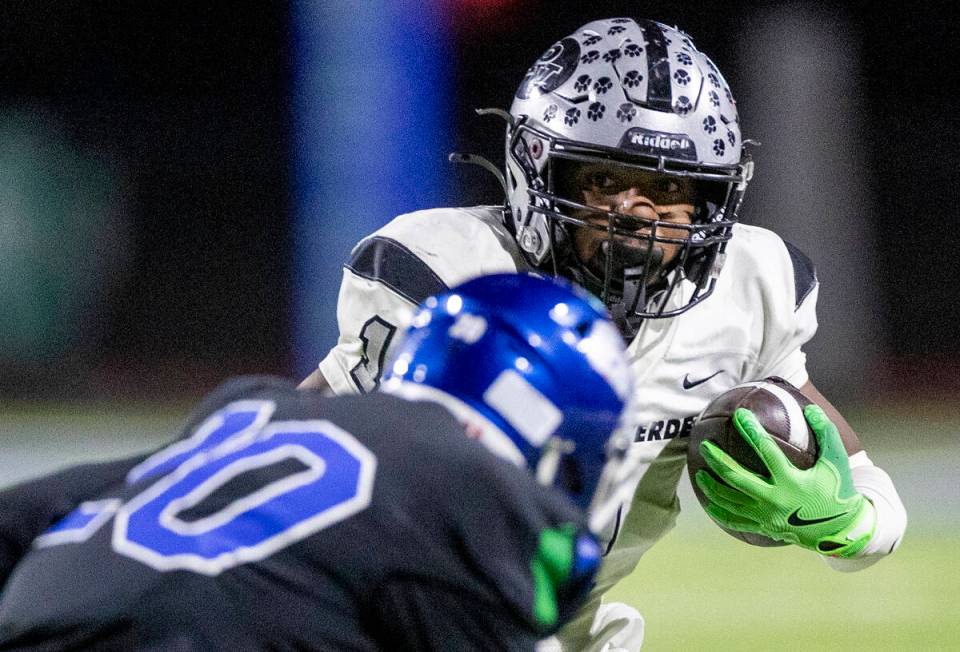 Palo Verde running back Bryant Johnson (1) looks to avoid a defender during the 5A Division II ...