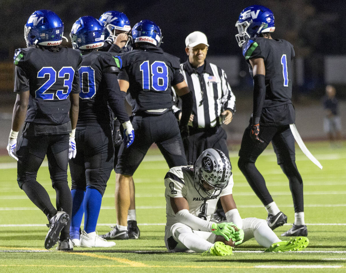 Green Valley senior Trey Glasper (1) sits on the turf after not converting on a third down duri ...