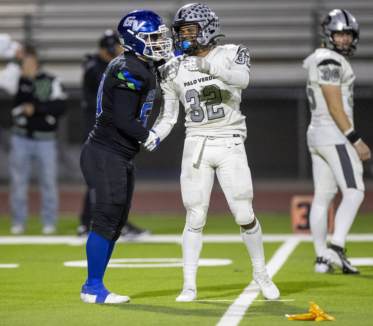 Green Valley senior Shawn Mckeon, left, and Palo Verde senior Wayne Braxton (32) shake hands af ...