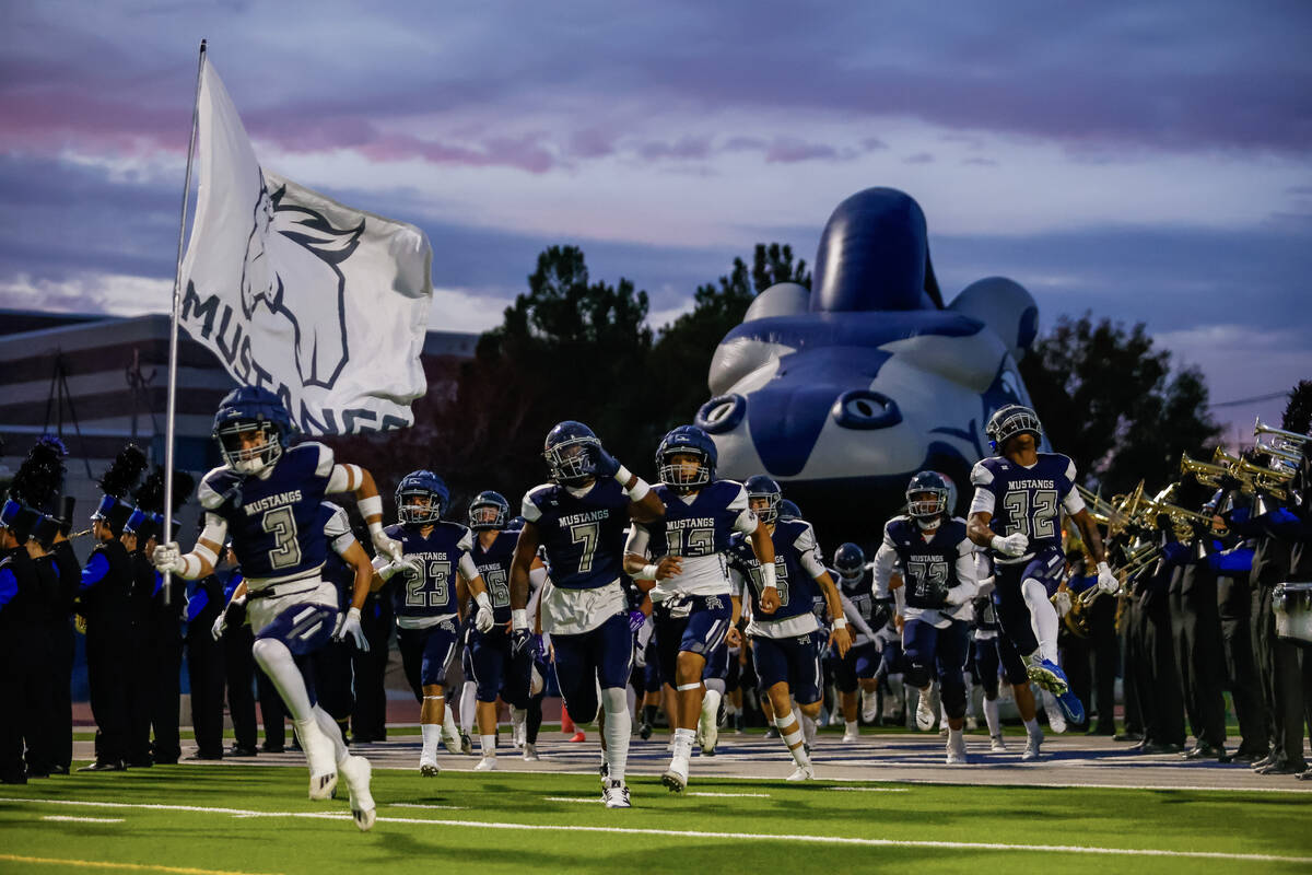 Shadow Ridge players run out onto the field before a 5A Division II Southern League quarterfina ...